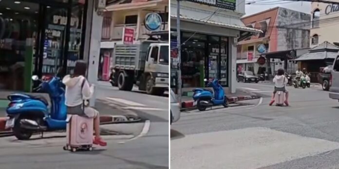 Tourist Caught Riding Suitcase on Busy Phuket Road